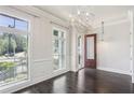 Bright entryway features a modern chandelier, large windows and hardwood flooring at 345 Alderwood Ln, Sandy Springs, GA 30328