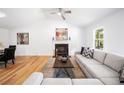 Bright living room with fireplace, vaulted ceilings, hardwood floors and modern decor at 1080 Rackley Nw Way, Kennesaw, GA 30144