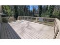 Spacious wooden deck with modern railings perfect for outdoor entertaining and relaxing in the backyard at 1978 Fisher Ne Trl, Atlanta, GA 30345