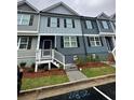 Charming two-story townhome featuring neutral siding, black shutters, and a welcoming front porch at 2832 Saratoga Lake Vw, Decatur, GA 30034