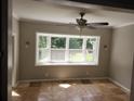 Inviting bedroom with a bay window and tile flooring for a warm and comforting interior at 3140 Kipling Dr, Powder Springs, GA 30127