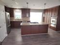 Spacious kitchen with stainless steel appliances, an island with a gas cooktop, and custom cabinetry at 3140 Kipling Dr, Powder Springs, GA 30127