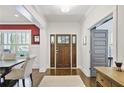 Bright foyer with hardwood floors, beautiful trim, and stylish decor at 1297 Conway Rd, Decatur, GA 30030