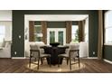 Inviting dining room with dark accent wall, seating six, with natural lighting at 243 Deer Valley Run, Canton, GA 30115