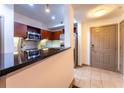 Modern kitchen with stainless steel appliances, granite countertops, and tiled floors at 390 17Th Nw St # 2040, Atlanta, GA 30363