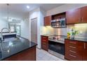 Modern kitchen with stainless steel appliances and granite countertops at 390 17Th Nw St # 2040, Atlanta, GA 30363