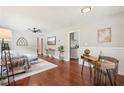 Inviting living room showcasing hardwood floors, tasteful decor, and an open view into the adjacent kitchen at 1120 Starline Se Dr, Smyrna, GA 30080