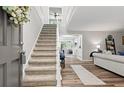 Bright entryway featuring a staircase and open access to the living room at 1143 Mcgarity Rd, Mcdonough, GA 30252