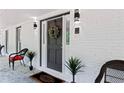 Inviting front porch with stylish decor and a welcoming entrance at 1143 Mcgarity Rd, Mcdonough, GA 30252
