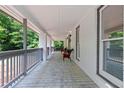 Long front porch with seating, perfect for relaxing outdoors at 1143 Mcgarity Rd, Mcdonough, GA 30252