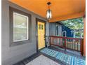 Inviting front porch features a stylish pendant light and a colorful welcome mat at 1336 Mcclelland Ave, Atlanta, GA 30344