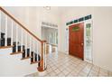 Inviting home foyer with a staircase, tiled floors, and a glimpse into the living area at 2682 Varner Dr, Atlanta, GA 30345