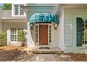 Close-up of the home's entrance featuring a stylish blue awning and elegant front door at 2682 Varner Dr, Atlanta, GA 30345