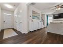 Welcoming foyer with dark wood floors, a console, and coat closet at 118 Woodhouse Cir, Acworth, GA 30102