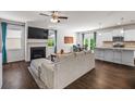 Cozy living room with a fireplace, hardwood floors, and open floor plan at 118 Woodhouse Cir, Acworth, GA 30102