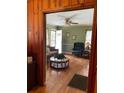 Inviting living room featuring gleaming hardwood floors, plenty of natural light, and a ceiling fan at 2530 Old Colony Rd, East Point, GA 30344