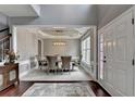 Elegant dining room featuring a tray ceiling and modern chandelier at 450 Hilingdon Way, Suwanee, GA 30024