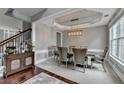 Dining room featuring modern chandelier and wainscoting at 450 Hilingdon Way, Suwanee, GA 30024