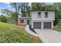 Charming two-story home with a front porch, freshly landscaped yard and a two-car garage at 4847 Royal Dr, Duluth, GA 30096