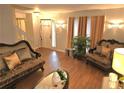 Cozy living room with hardwood floors, decorative lighting, and comfortable seating arrangement at 1012 Chapman Cir, Stone Mountain, GA 30088