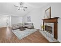 Bright living room featuring a fireplace, vaulted ceiling, and neutral colors at 4941 Lighthouse Pointe, Acworth, GA 30101