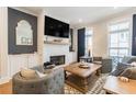 Cozy living room featuring a brick fireplace, large TV, and comfortable seating at 1964 Attell Way, Decatur, GA 30033