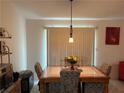 Cozy dining area featuring a tile-top table with decorative chairs and soft, natural lighting at 3505 Saddle Creek Ln, Ellenwood, GA 30294