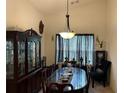 Traditional dining room with a large dining table, elegant chandelier, and tasteful decor at 3505 Saddle Creek Ln, Ellenwood, GA 30294