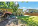 Spacious backyard with a green lawn, surrounded by a wooden fence and mature trees for added privacy at 1025 Whitfield Ct, Smyrna, GA 30080