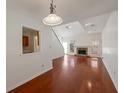 Bright living room with hardwood floors, a stone fireplace, and ample natural light, perfect for entertaining at 1025 Whitfield Ct, Smyrna, GA 30080