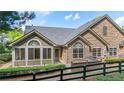 Attractive home featuring a stone and siding facade, complemented by well-manicured landscaping at 5336 Stone Village Nw Cir # 2, Kennesaw, GA 30152