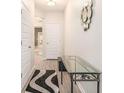 Welcoming entryway featuring modern decor, a stylish rug, and a decorative mirror at 2140 Ravencliff Dr, Austell, GA 30168