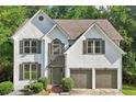 Attractive two-story home with an attached two-car garage and neatly manicured front yard at 1097 Soaring Way, Marietta, GA 30062