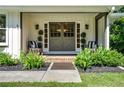 Inviting front porch with stylish seating and manicured landscaping, creating a welcoming entrance at 290 Dania Dr, Alpharetta, GA 30009