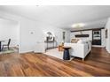 Spacious living room featuring wood floors and a fireplace, perfect for relaxation at 290 Dania Dr, Alpharetta, GA 30009