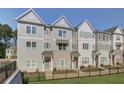 Charming townhome community featuring well-manicured lawns and stylish architectural details at 3348 Cranston Ln, Kennesaw, GA 30144
