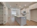Spacious kitchen with a large center island, stainless steel appliances, and white cabinets at 3348 Cranston Ln, Kennesaw, GA 30144