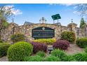 Stone entrance to Chattahoochee Reserve surrounded by colorful landscaping and shrubbery at 3925 Tugaloo River Dr, Duluth, GA 30097