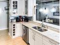 Kitchen features light granite countertops, an undermount sink, and stainless steel appliances at 800 Peachtree Ne St # 1319, Atlanta, GA 30308