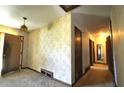 Hallway featuring vintage wallpaper and doors leading to other rooms at 1305 Lenox Cir, Atlanta, GA 30306