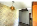 Hallway featuring vintage wallpaper and an interesting light fixture at 1305 Lenox Cir, Atlanta, GA 30306