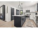 Modern kitchen featuring stainless steel appliances, an island, and a tile backsplash at 3337 Toney Dr, Decatur, GA 30032
