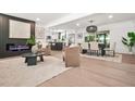 Open living space with fireplace, dining area and modern kitchen at 3337 Toney Dr, Decatur, GA 30032
