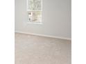 Neutral bedroom with a window providing natural light and neutral carpeting at 7205 Brushwood Bend (Lot 31), Lithonia, GA 30058