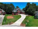 Beautiful brick home with landscaped front yard and long driveway at 781 Templeton Dr, Loganville, GA 30052