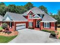 Beautiful brick home with attached garage and lush landscaping at 781 Templeton Dr, Loganville, GA 30052