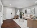Bright living room featuring hardwood floors, a modern sofa, and a decorative coffee table at 3149 Buford Hwy # 3, Brookhaven, GA 30329