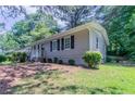 A beautiful single-story home with well-maintained landscaping and traditional design elements at 881 Mercury Nw Dr, Atlanta, GA 30331