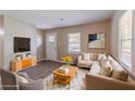 Inviting living room with a neutral color palette, cozy furniture, and ample natural light at 881 Mercury Nw Dr, Atlanta, GA 30331