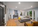 Bright living room with hardwood floors, stylish decor, and sliding doors to the outside at 1445 Monroe Ne Dr # C13, Atlanta, GA 30324